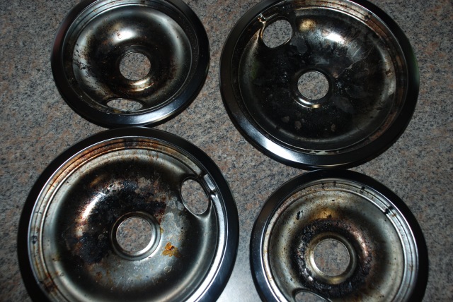 Dirty drip pans on counter